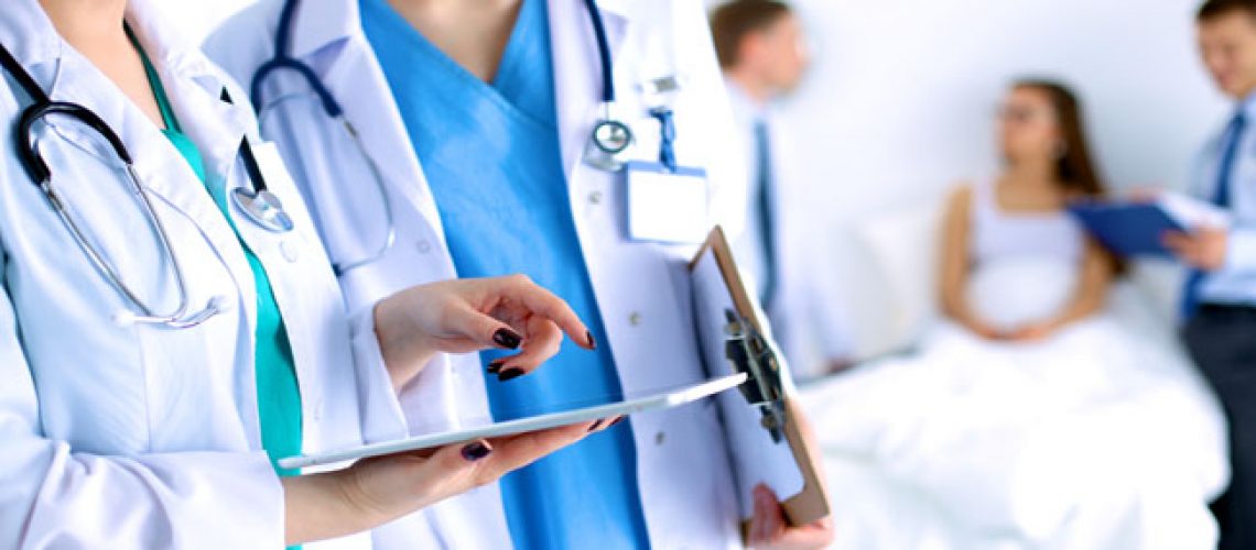 Young woman  doctor holding a tablet pc .