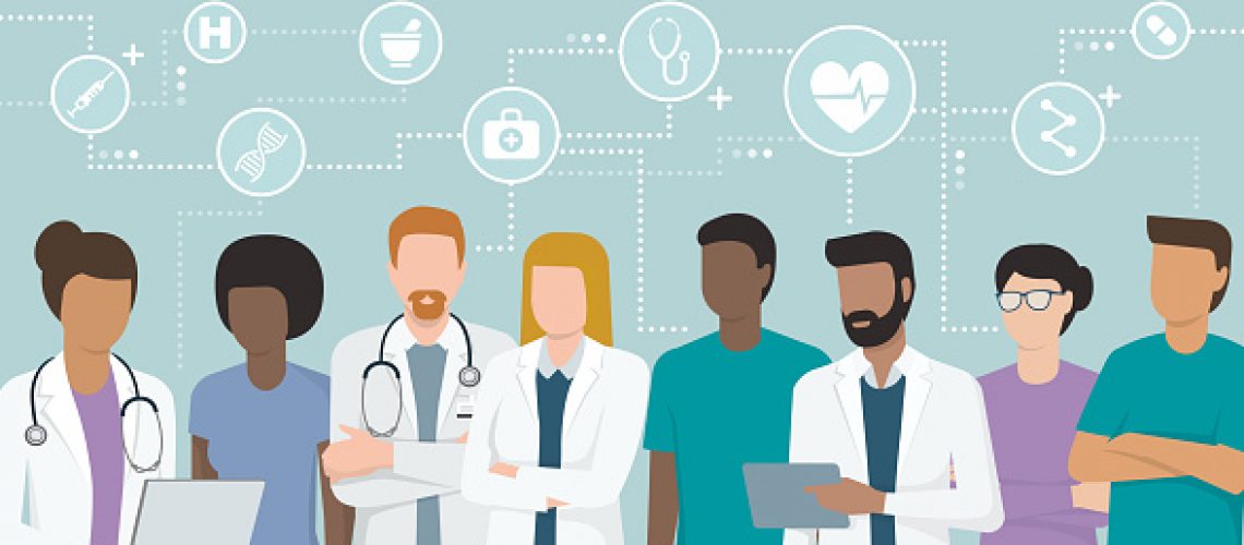 Multiethnic team of doctors and nurses working together, network of concepts on the top: healthcare and medicine