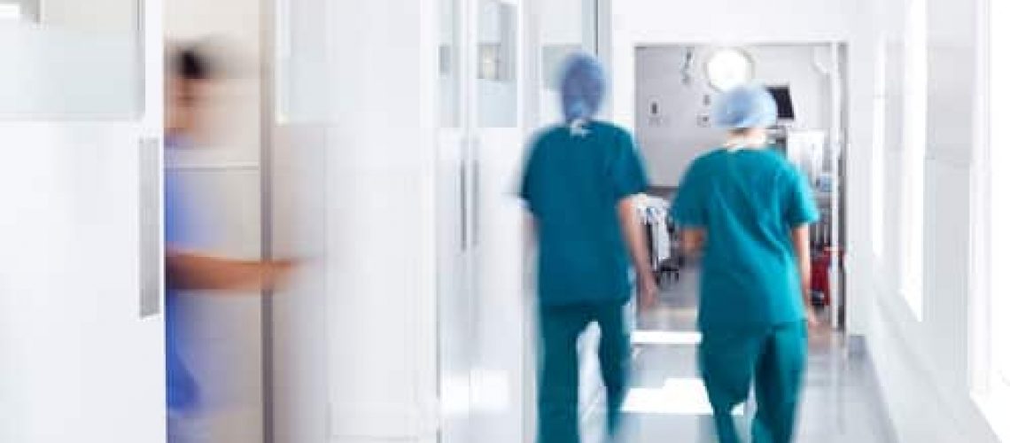 Motion,Blur,Shot,Of,Medical,Staff,Wearing,Scrubs,In,Busy